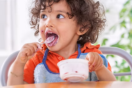 Child in feeding therapy working on swallow skills
